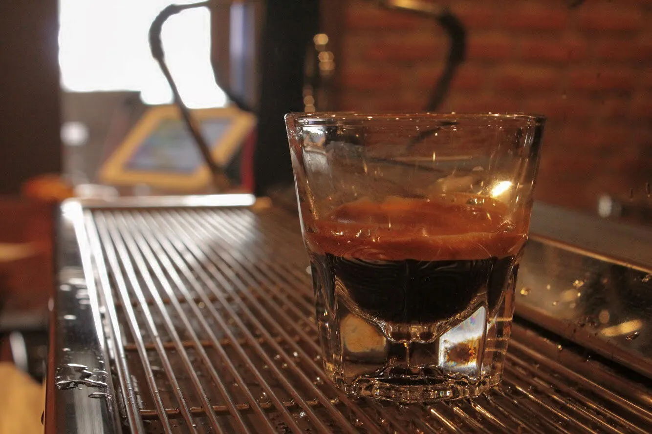 An espresso pulled over ice on the bar at The Brew Cafe
